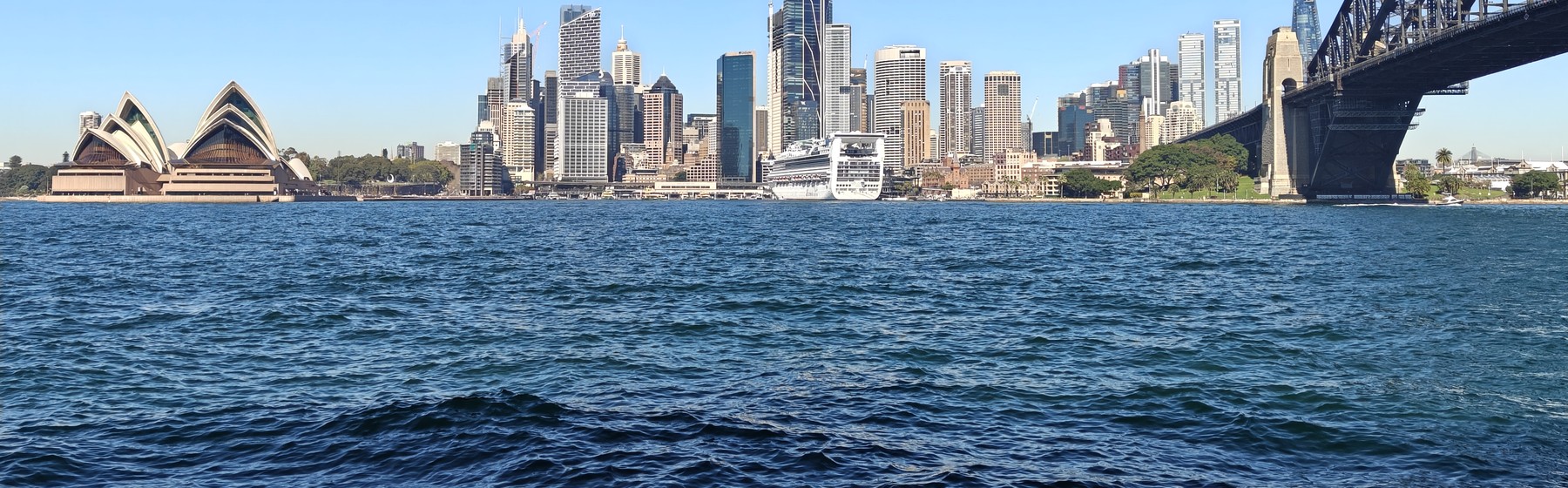 Sydney skyline between the Opera House and Harbour Bridge
